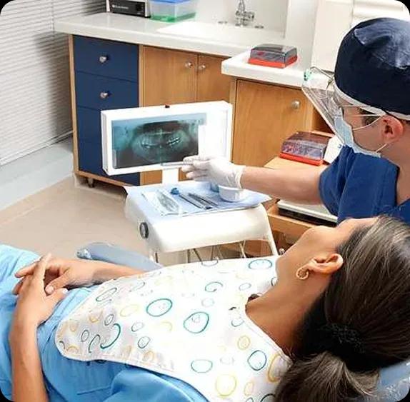 dentist-with-patient-574x563